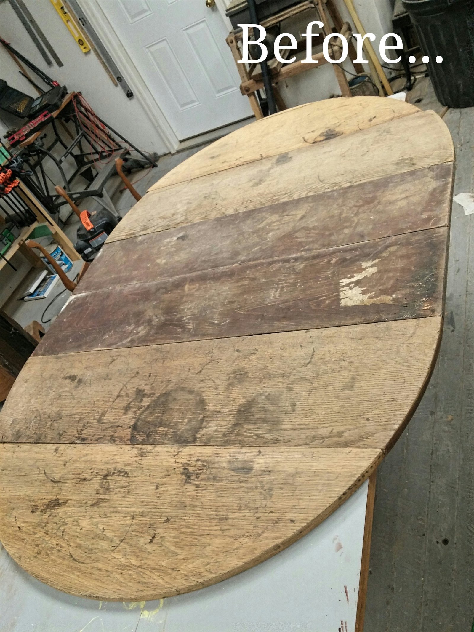 Weathered round plank tabletop before stripping and refinishing